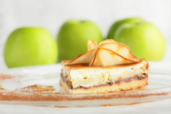 Tasty peace of cake in white dish — Stock Photo, Image