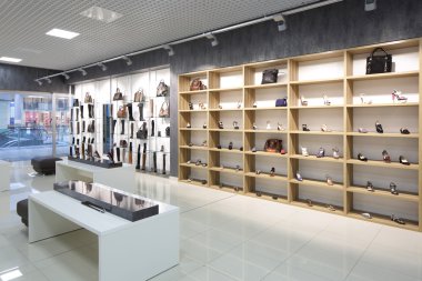 interior of shoe store in modern european mall clipart