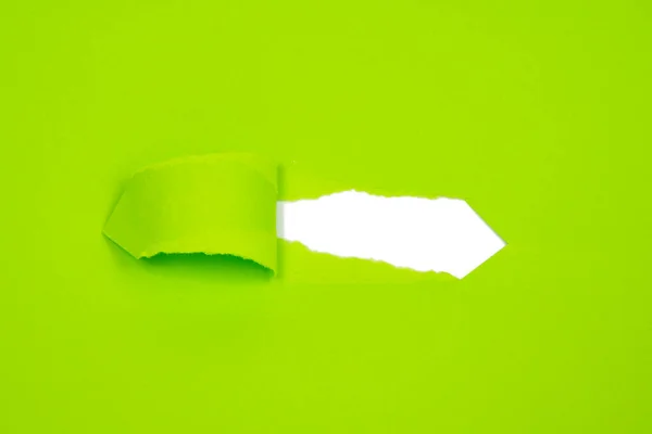 Hole in paper green background torn damaged for design