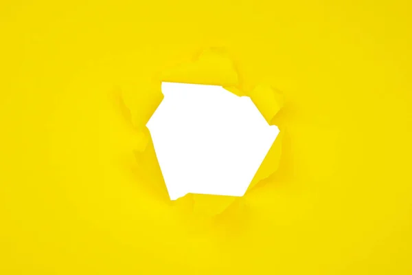 Yellow torn paper hole craft concept background