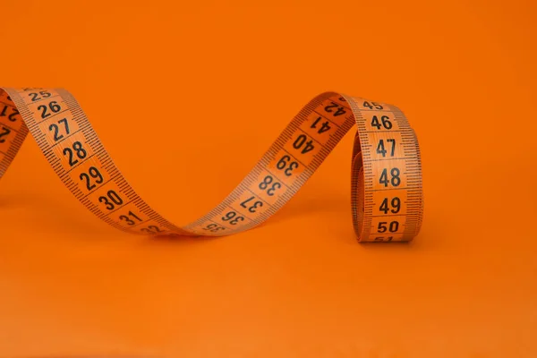 Spiral Orange Tape Measure Colorful Background Copyspace — Stockfoto