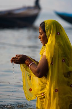 Hindu Woman Cupped Praying Ganges River Varanasi clipart