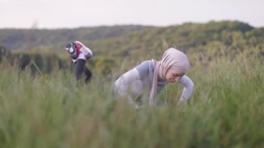 Portrait of attractive young Muslim woman workout outdoor