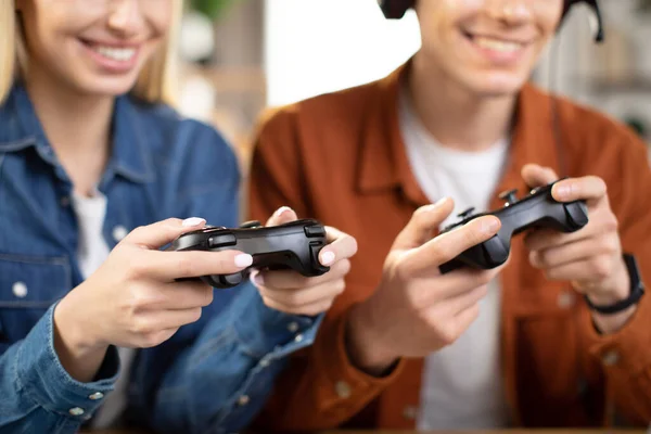 Caucasian family hands, holding joysticks and enjoying their free time playing new games at home — Foto de Stock