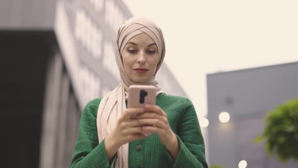 Close Pleasant Business Woman Hijab Using Modern Smartphone While Standing — Stock Video