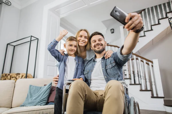 Smiling Family Standing Father Special Needs Looking Smartphone Camera Online — Fotografia de Stock