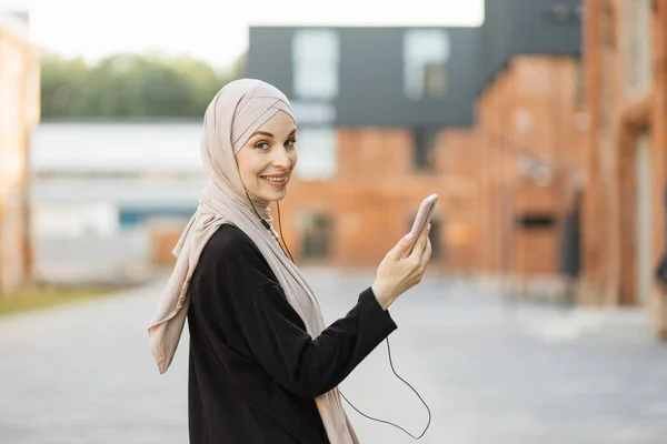 Arabic Muslim Young Women Wearing Hijab Listening Music Headset Having — Stock Fotó