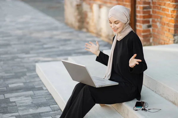 Portrait Smiling Happy Muslim Woman Relaxing Using Digital Laptop While — 스톡 사진
