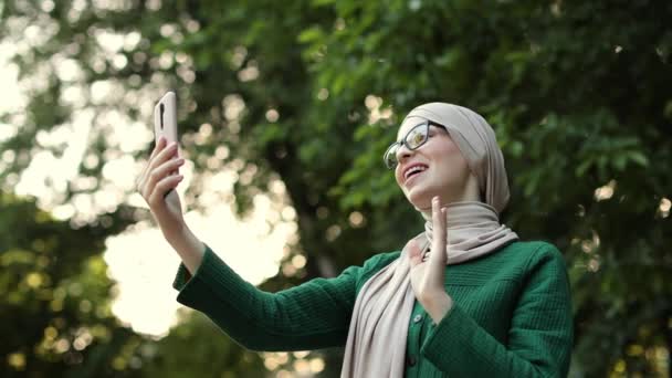 Smiling Happy Beautiful Muslim Woman Relaxing Using Digital Smartphone Young — Stockvideo