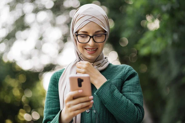Young Muslim Woman Listening Music While Walking City Park Arab — Stock Fotó