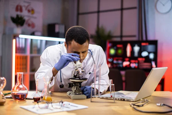 Young African American Male Researcher Looking Microscope Analyze Science Forensics — Stok fotoğraf