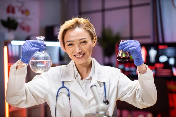 Positive Female Scientist Medical Lab Coat Holding Test Tube Reagent — Stok fotoğraf