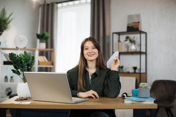 Smiling Female Freelancer Playing Paper Plane While Working Home Attractive — Stock fotografie