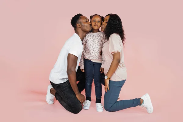 Happy African American Woman Her Husband Kissing Daughter Pink Background — Fotografia de Stock