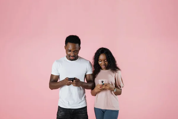 Cheerful African American Millennial Couple Browsing Cell Phones Networking Chatting — Fotografia de Stock