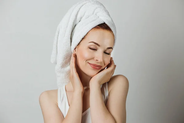 Caucasian Young Lady White Towel Touching Gently Her Cheek Smiling — Zdjęcie stockowe