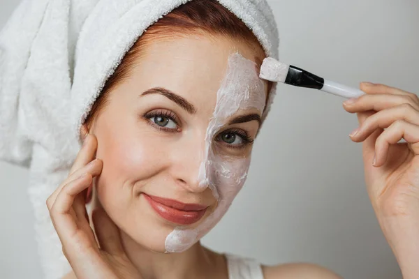 Caucasian Young Woman Towel Using Brush Applying White Cosmetic Cream — Stok Foto