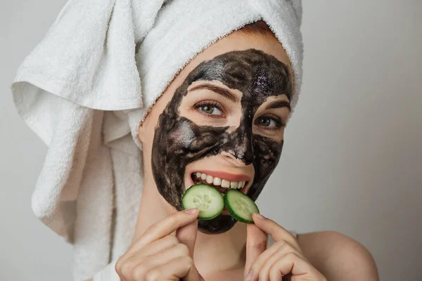 Portrait Caucasian Young Woman Black Clay Mask Towel Her Face — Stok Foto