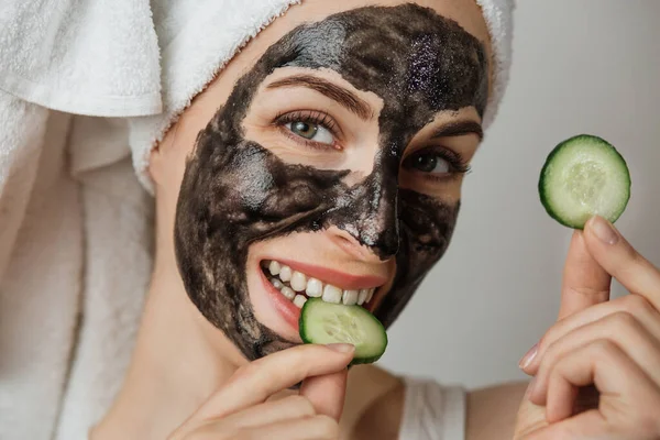 Attractive Young Woman Black Cosmetic Mask Her Face Eating Slice — Stok Foto