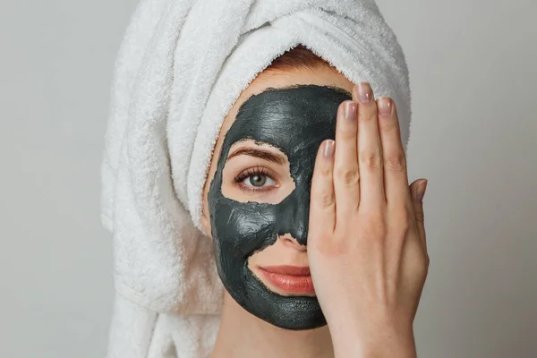 Pleasant Woman Towel Black Cosmetic Moisturizing Mask Covers Half Her — Stock Photo, Image