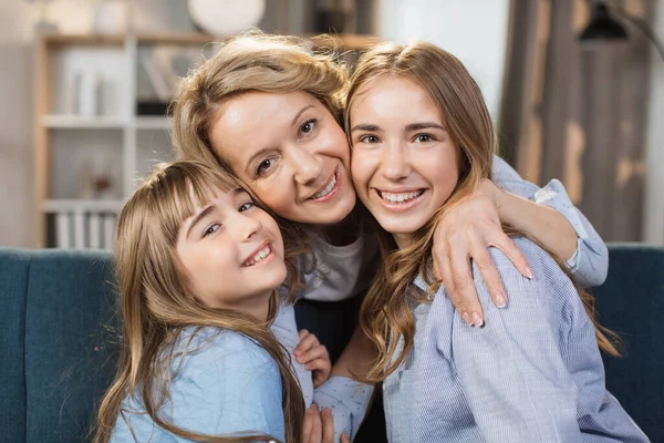 Portrait Happy Two Daughters Hugging Pleasant Smiling Middle Age Mother — Stok fotoğraf