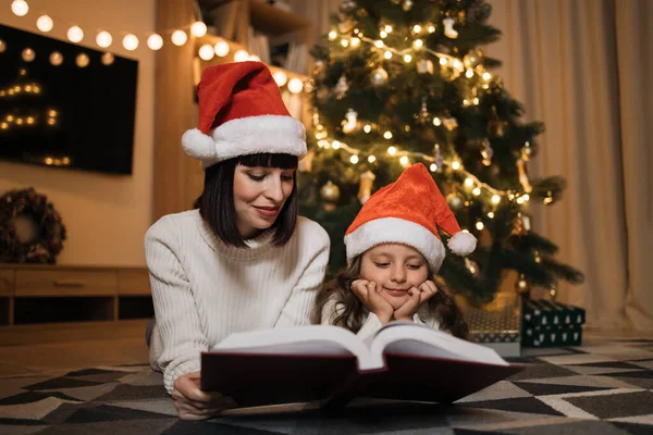 Pretty Young Mother Santa Hat Reading Magical Fairy Tale Book — Stock Photo, Image