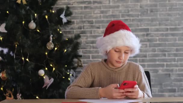 Boy Red Santa Hat Looking Smartphone Green Screen Smile Playing — Stock Video