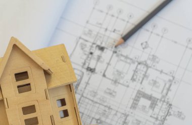 Yaratıcı düz görünüm bulanık planlar mimari düz proje planı ve dekoratör beyaz masa çalışma alanı gereçleri arka plan kopyalama alanı üzerindeki ev modeli