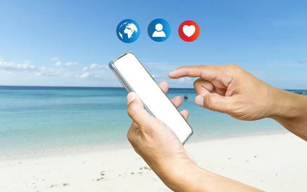 a human using a smartphone with Social media. The concept of living on vacation and playing social media. Social Distancing, Social media and digital online concept, Traveling concept.