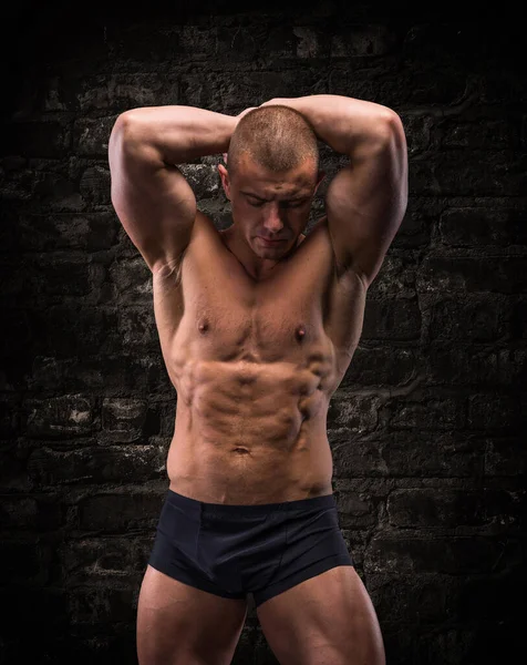 Handsome Posing Bodybuilder Background Brick Wall — Zdjęcie stockowe