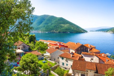 Redroof houses in Kotor with the view of sea and mountains
