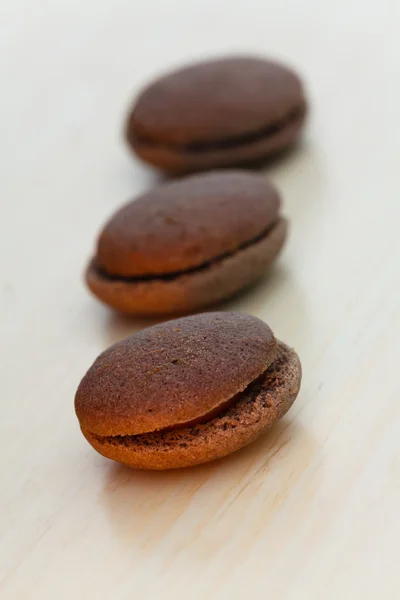 Chocolate marron cookies with black chocolate cream — Stock Photo, Image