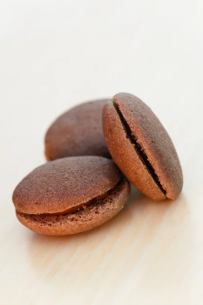 Chocolate marron cookies with black chocolate cream — Stock Photo, Image