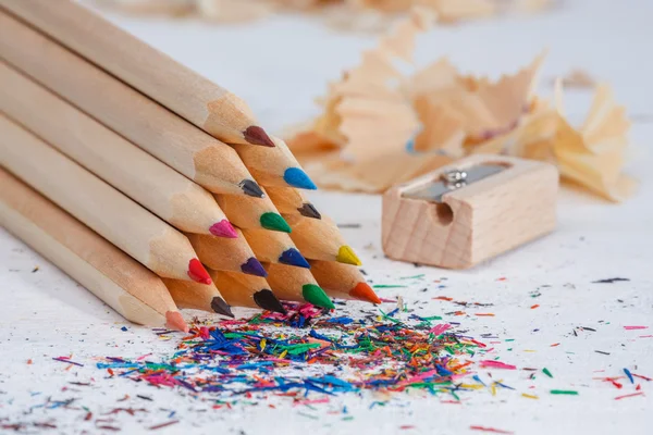 Triangular pile of colored wooden pencils — Stock Photo, Image