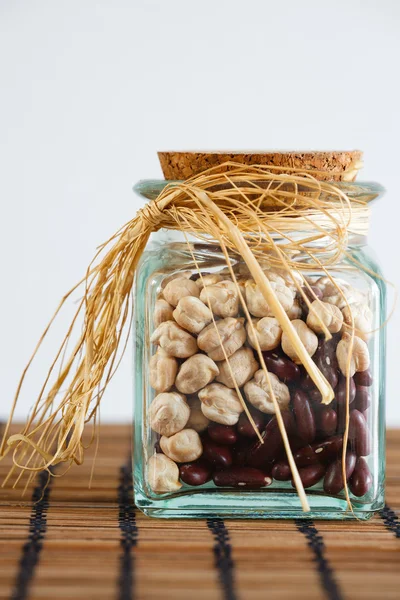 Jar with dryed chickpea and black beans — Stock Photo, Image