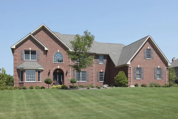 Brick home with arched entry — Stock Photo, Image