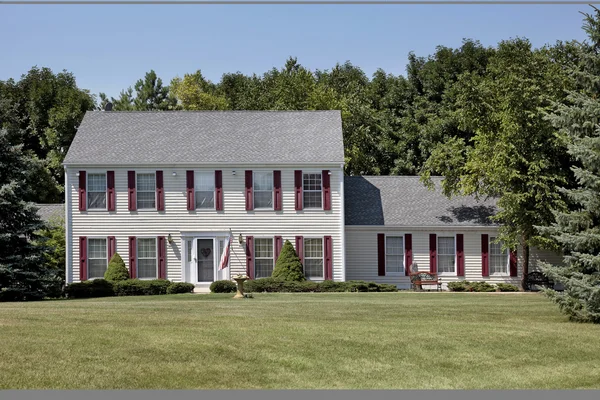 Home with maroon shutters — Stock Photo, Image