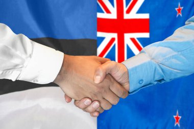 Business handshake on background of two flags. Men handshake on background of Estonia and New Zealand flag. Support concept