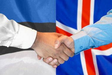 Business handshake on background of two flags. Men handshake on background of Estonia and Iceland flag. Support concept