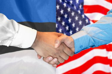 Business handshake on background of two flags. Men handshake on background of Estonia and US flag. Support concept