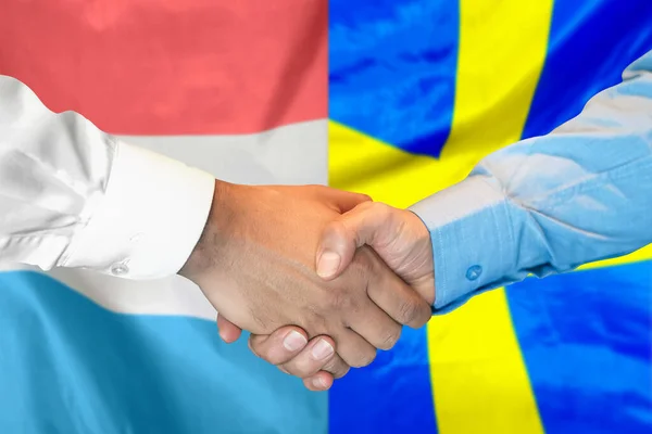 Business Handshake Background Two Flags Men Handshake Background Luxembourg Sweden — Zdjęcie stockowe