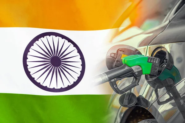 Car with a fuel injector on India flag background. Record prices fuel for population. Gasoline price increase during energy and fuel world crisis in India