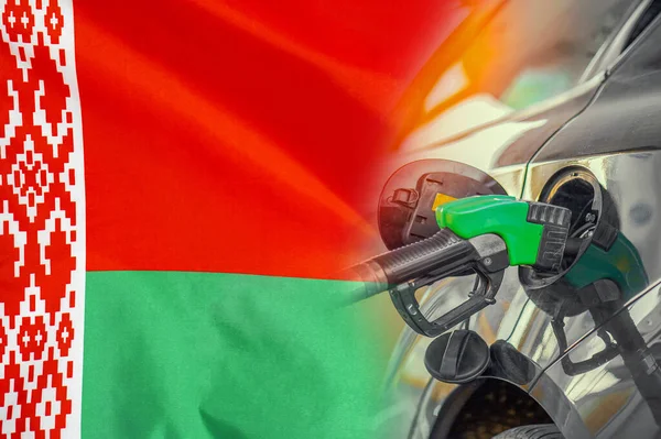 Car with a fuel injector on Belarus flag background. Record prices fuel for population. Gasoline price increase during energy and fuel world crisis in Belarus