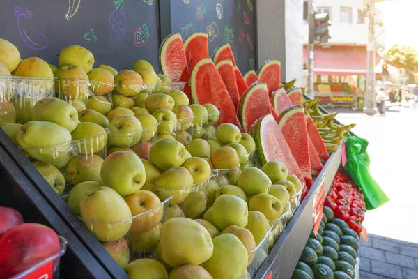 Fruit stall in market shop street. Fresh fruits and vegetables sold at the street market in Israel. Fruit stall on the street Tel Aviva. Fresh apples or watermelons on display at a fruit stand market in Tel Aviv