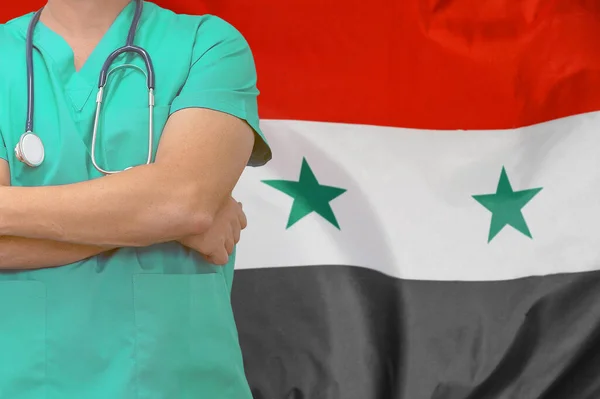 Male surgeon or doctor with stethoscope on the background Syria flag. Health care and medical concept. Surgery concept in Syria