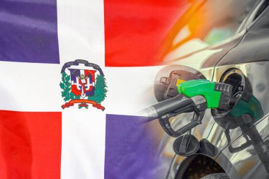 Car with a fuel injector on Dominican Republic flag background. Record prices fuel for population. Gasoline price increase during energy and fuel world crisis in Dominican Republic