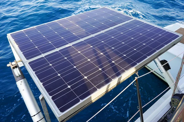 Solar panel on sailing yacht in the sea. Monocrystalline and Polycrystalline Solar Panels in yachting. Solar panel, photovoltaic, alternative electricity source on boat.