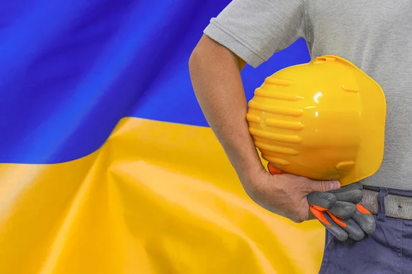 Close Hard Hat Holding Construction Worker Ukraine Flag Background Hand — Foto Stock