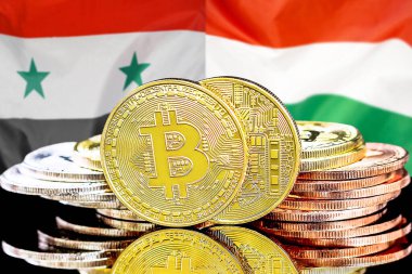 Bitcoins on flag Syria and Hungary background. Concept for investors in cryptocurrency and Blockchain technology in Syria and Hungary