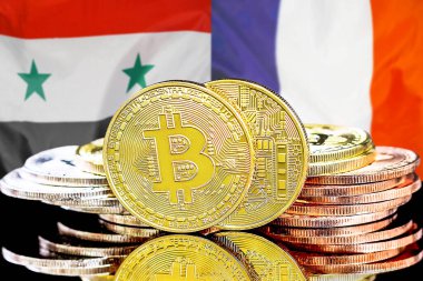 Bitcoins on flag Syria and France background. Concept for investors in cryptocurrency and Blockchain technology in Syria and France